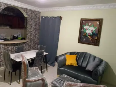 a living room with a couch and a table at confor y seguridad in Santo Domingo