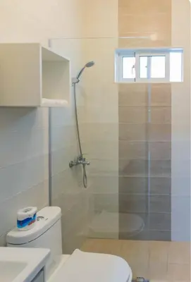 a bathroom with a shower and a toilet at Esmeralda modern apartment at Romana del Oeste in La Romana