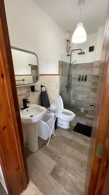 a bathroom with a sink and a toilet and a shower at Residencial Paraiso in Bayahibe