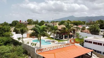 an aerial view of a resort with a swimming pool at villa cueva del padre pio in Santiago de los Caballeros
