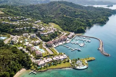 an aerial view of a resort with boats in the water at Penthouse Suite at Puerto Bahia in Samana in Los Grini