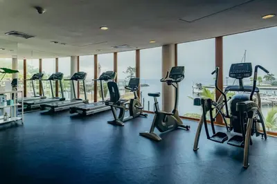 a gym with treadmills and ellipticals in a building at Penthouse Suite at Puerto Bahia in Samana in Los Grini