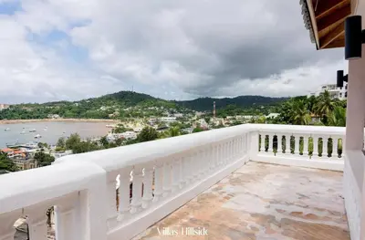 a white balcony with a view of the ocean at Villas Hillside apt 3 in Santa Bárbara de Samaná