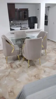 a dining room with chairs and a glass table at Villas Hillside apt 3 in Santa Bárbara de Samaná