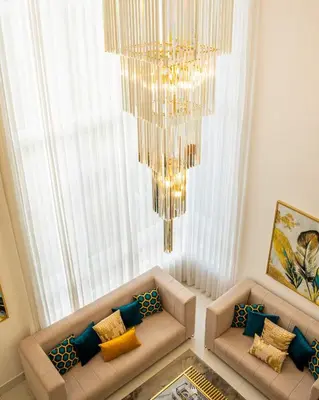 a living room with two couches and a chandelier at Modern and luxurious house in Santiago in Santiago de los Caballeros
