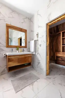 a bathroom with a sink and a mirror at Luxurious Home with Pool in San Felipe de Puerto Plata