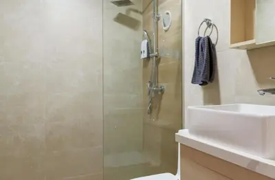 a bathroom with a shower and a toilet and a sink at Bran new condo with pool access in Punta Cana