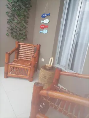 a living room with a chair and a window at Vista al mar in Boca Chica