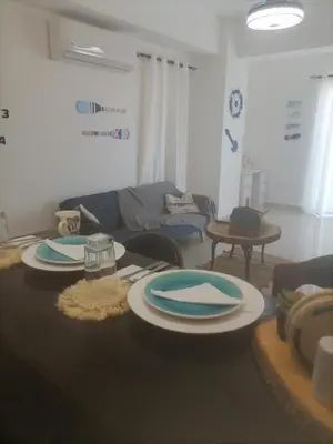 a living room with two plates on a table at Vista al mar in Boca Chica