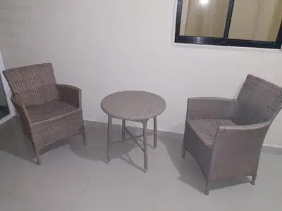 a table and two chairs and a table and a table and chairs at Apartahotel-E vista catalina in La Romana