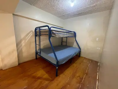 a bunk bed in the corner of a room at Loft's R&L in Juan de Herrera