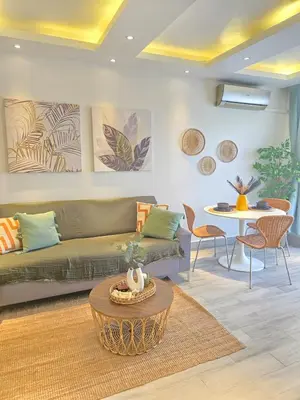 a living room with a couch and a table at Beautiful Apartment 10 min from Bayahibe beach Las Terrazas in Bayahibe