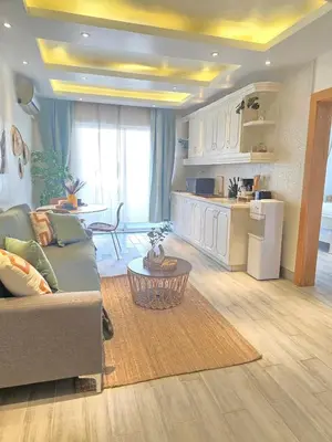 a living room with a couch and a table at Beautiful Apartment 10 min from Bayahibe beach Las Terrazas in Bayahibe