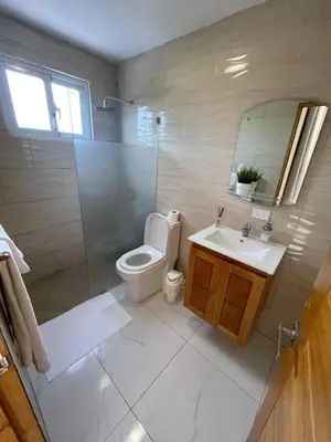 a bathroom with a toilet and a shower and a sink at Villa VP One - Punta rucia beach in Punta Rucia