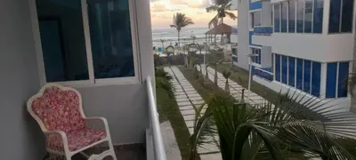 a balcony with a chair and a view of the beach at Luxury in Cabarete