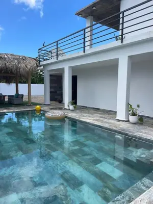 a swimming pool in front of a house at Apartamento Entre Playas - 5 pax, 4 min de la playa in Las Galeras