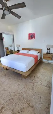 a bedroom with a large bed in a room at Bella Villa Apart for 2 with kitchen pool and close to the beach in Las Galeras