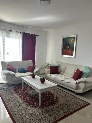 a living room with two couches and a coffee table at Gran Apartamento frente al mar in La Francia