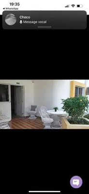 a picture of a living room with a table and chairs at Kasita del sol boca chica in Boca Chica