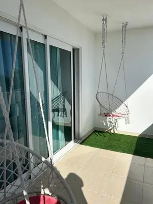 an empty balcony with a swing on a building at Vista al Caribe in La Francia
