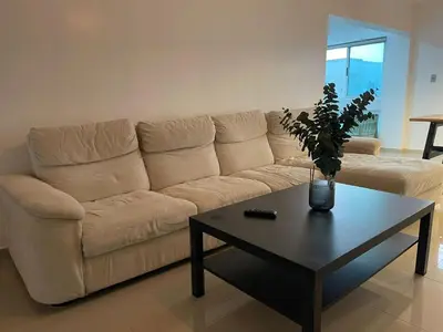 a living room with a couch and a coffee table at Vista al Caribe in Los Mameyes