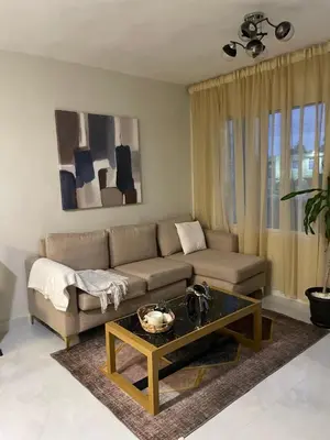 a living room with a couch and a coffee table at Heaven apart cerca del aeropuerto parqueo incluído TAXI DISPONIBLE in Monte Adentro