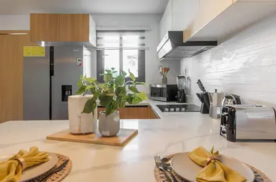 a kitchen with a table with a plate of food at Amazing pool views apartment in Playa Bavaro in Punta Cana