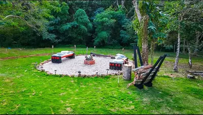 a small firepit in a park with a fire truck at Villa moderna 95 in San José de Las Matas