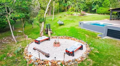 an aerial view of a backyard with a fire pit at Villa moderna 95 in San José de Las Matas