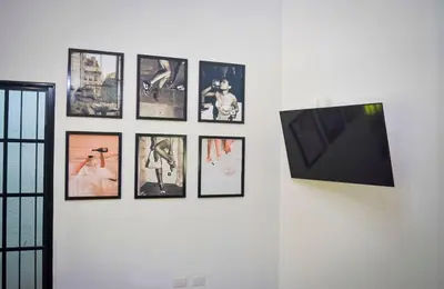a group of pictures on a white wall at Villa moderna 95 in San José de Las Matas