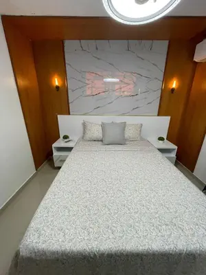 a bedroom with a large white bed in a room at Modern, Unique And Stylish 1 Bedroom Apartment in San Pedro de Macorís