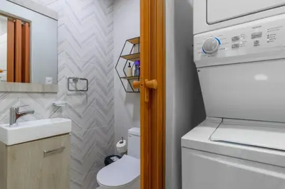 a small bathroom with a toilet and a sink at La Condesa del Vergel in Santo Domingo