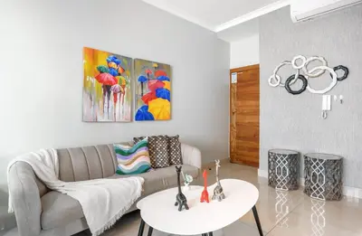 a living room with a couch and a table at La Condesa del Vergel in Santo Domingo