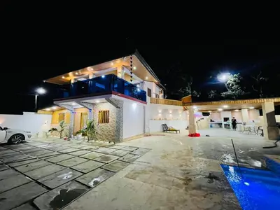 a large house at night with lights on it at Villa Estela Jarabacoa in Jarabacoa