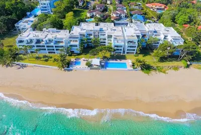 an aerial view of a resort on a beach at Bluegreen Oceanfront Condo at Laguna Beach in Sosúa