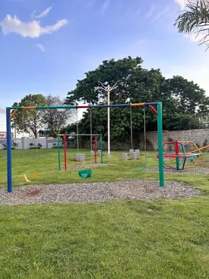 a playground with colorful play equipment in a park at Santo Domingo Este Stylish Condo in San Isidro