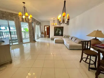 a large living room with a couch and a table at Spacious apartment beach access in Juan Dolio
