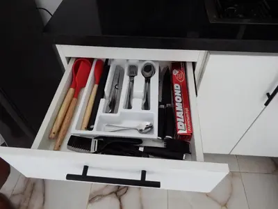 a drawer filled with utensils in a kitchen at APE Dream Villa in Itabo