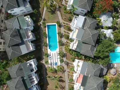 an overhead view of houses and a swimming pool at Gorgeous apartment steps to Playa Punta Popy in Las Terrenas