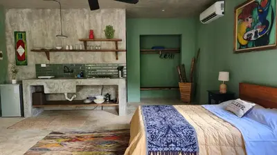 a bedroom with a bed and a sink in it at Boho villas and spa in El Valle