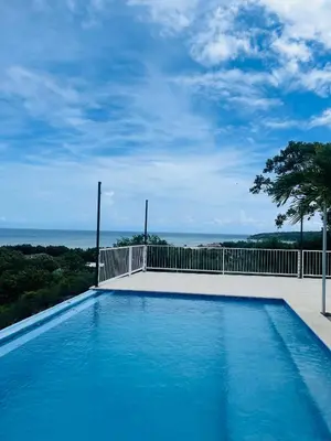 a swimming pool with a view of the ocean at Sundown Relaxed in Punta Rucia