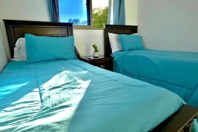 two beds sitting next to each other in a bedroom at Villa Pravda Paradise Guerra in La Caoba