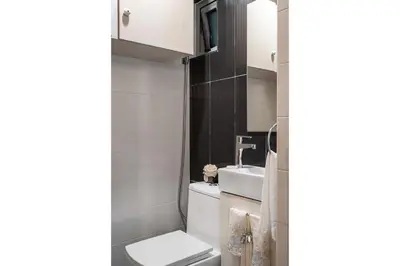 a bathroom with a toilet and a sink at Armonia 17 suites by Yellowkey in Santo Domingo