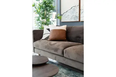 a living room with a brown couch in a room at Armonia 30 suites by Yellowkey in Los Prados