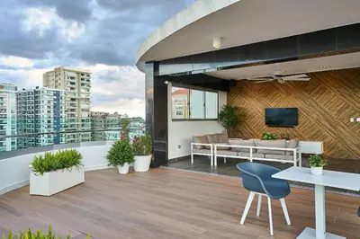 a balcony with a view of a city at Armonia 30 suites by Yellowkey in Los Prados