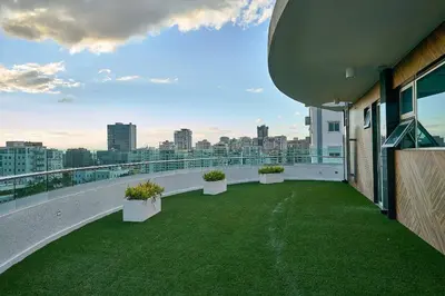 a balcony with green grass and plants on a building at Armonia 30 suites by Yellowkey in Los Prados