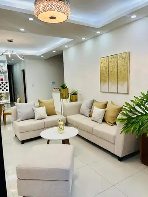 a living room with two couches and a table at Marbella in San Felipe de Puerto Plata