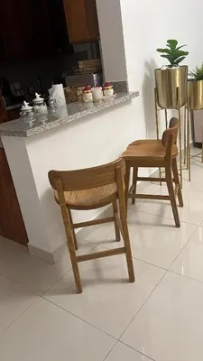a wooden chair and a table in a kitchen at Marbella in San Felipe de Puerto Plata