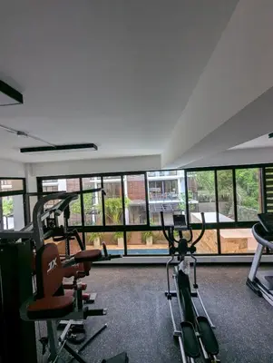 a gym with two treadmills and two exercise bikes at Marbella in San Felipe de Puerto Plata