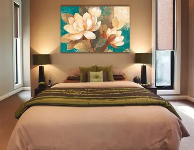a bedroom with a large bed with a painting on the wall at Punta cana in El Seis